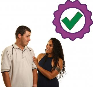 A woman supporting a man and a badge with a tick on it