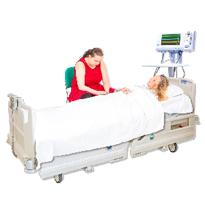 Very sick person in hospital bed